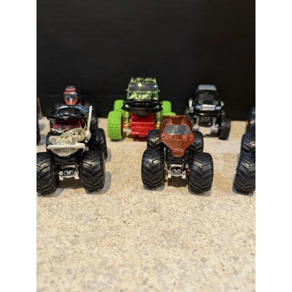 Hot Wheels Monster Trucks Lot of 12 1:64 Wonder Woman Skull Camo Flame Mixed